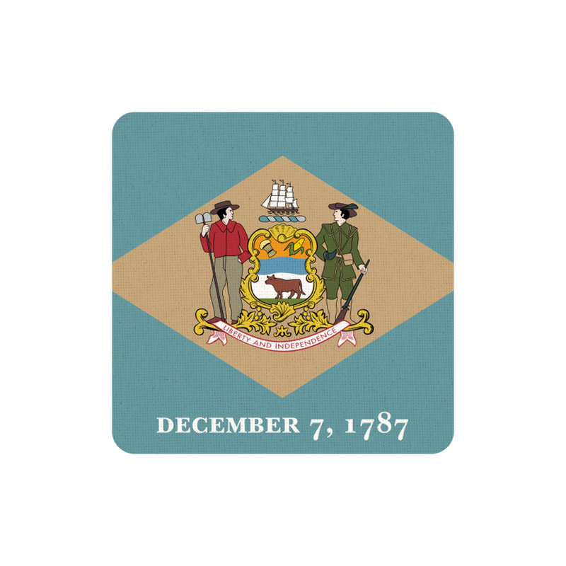 Coaster with a design of two figures, a ship, and a bear, set against a blue and beige background with text 'December 7, 1787'.